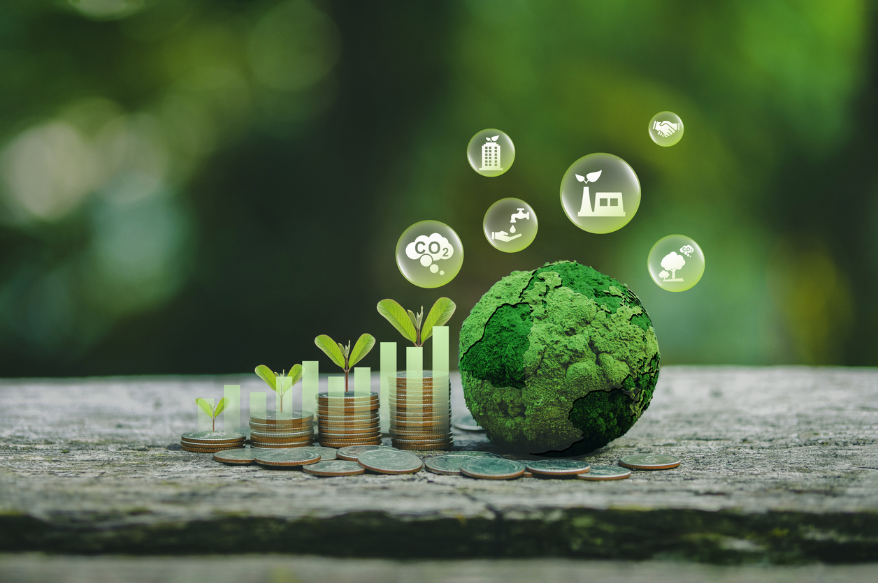 Green business growth. Sustainable investment finance, ESG funds or sustainability funds. A tree grows on a pile of coins with a graph and a green globe with icons